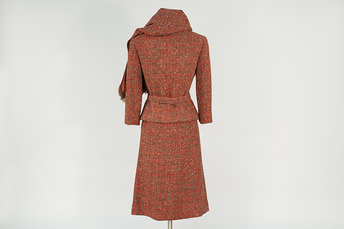 Image of Red suit with stole, modeled in the Seattle World's Fair Fashion Pavilion, 1962